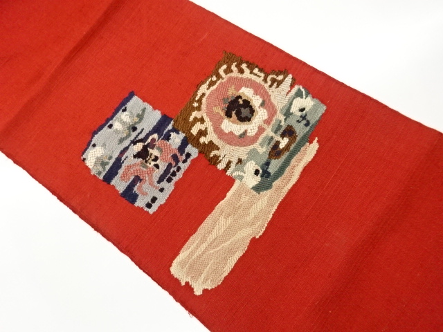 手織り紬色紙に騎馬・抽象模様織出し名古屋帯